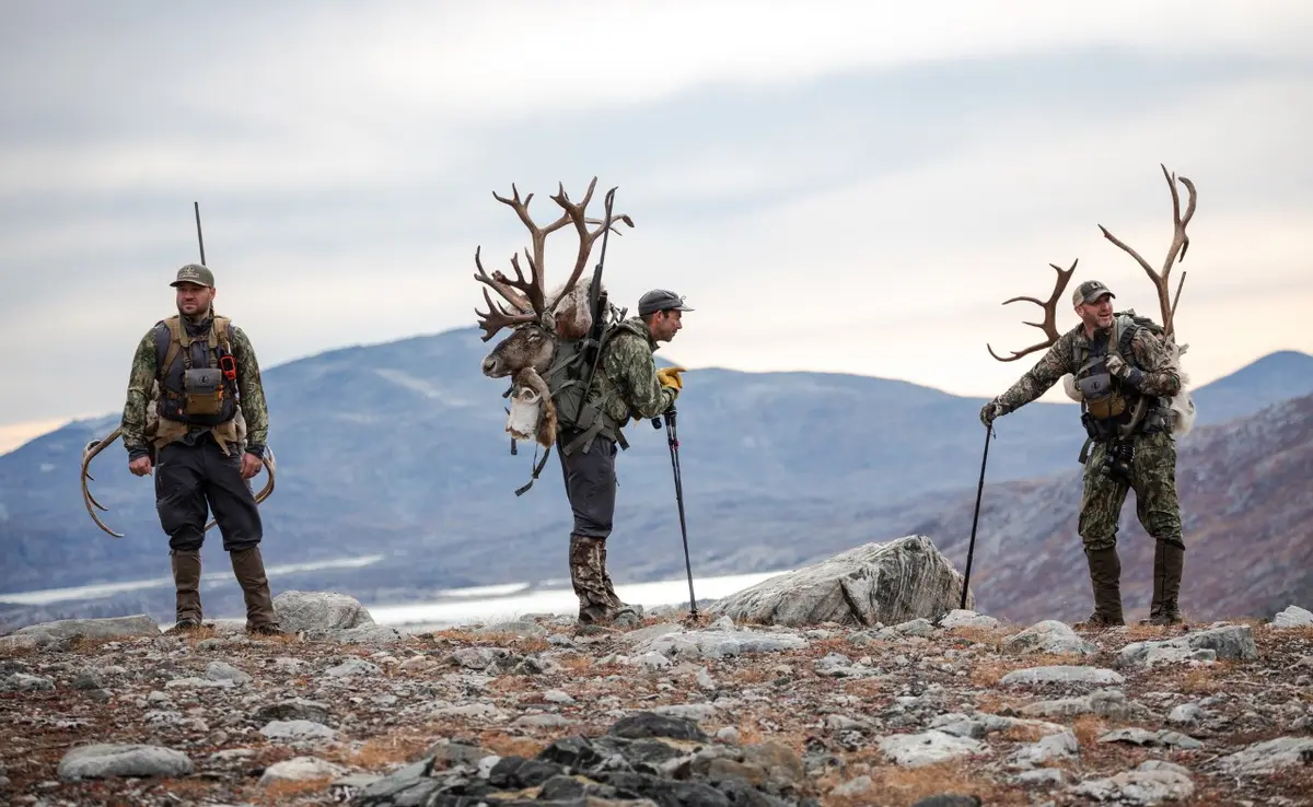 Shane Meisel, Andrew McKean and Rafe Nielsen pack their trophies back to base camp.