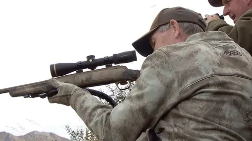 Hunter aiming an X-Bolt rifle.