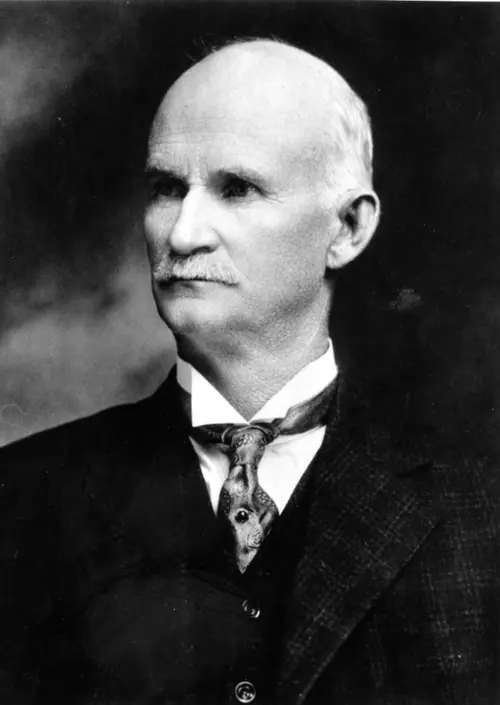 John M Browning portrait in tie